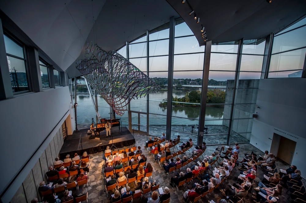 A String Theory concert in the Hunter Museum's glass gallery overlooking the Tennessee River at dusk